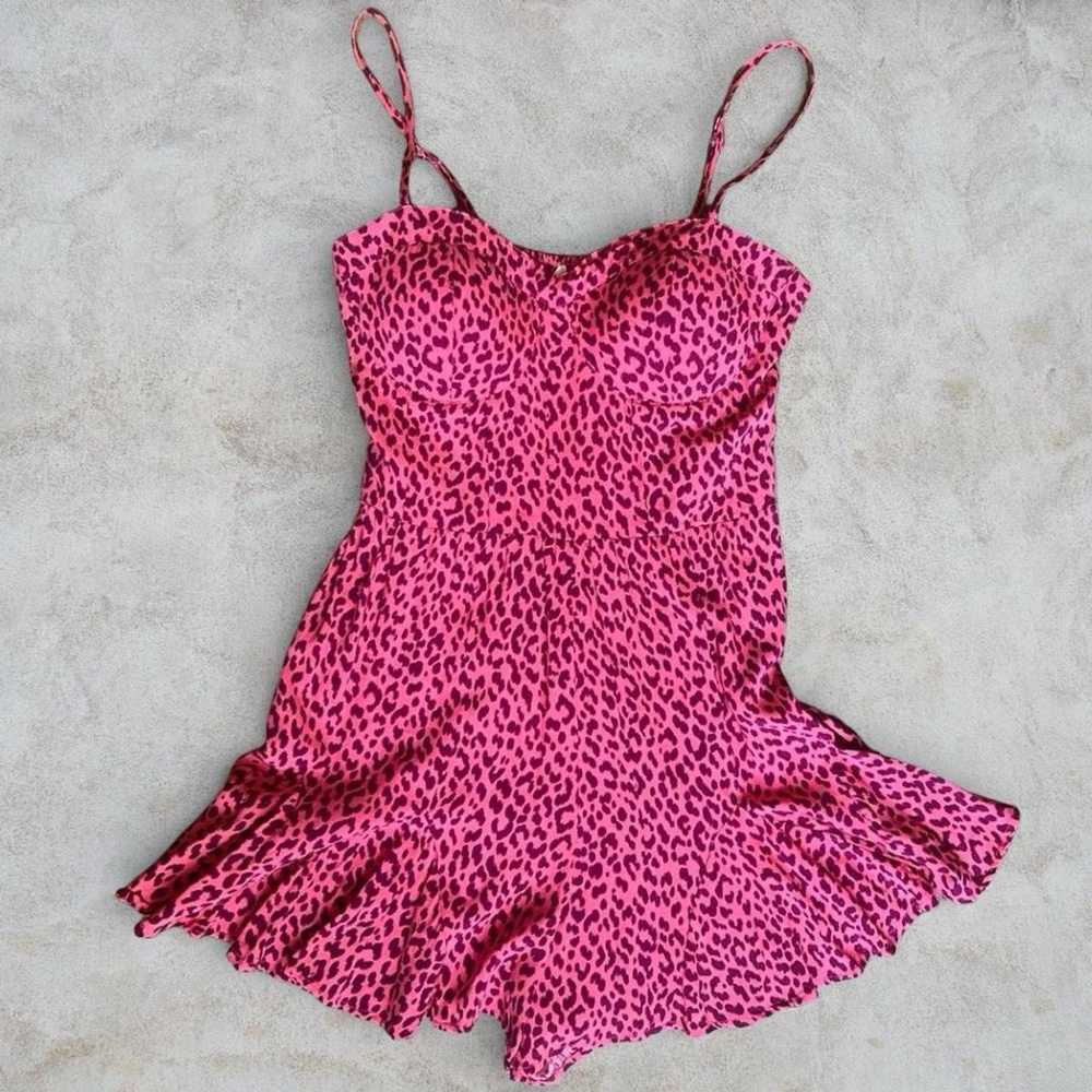 SOLD: Francesca's pink leopard print romper with adjustable straps and elastic
